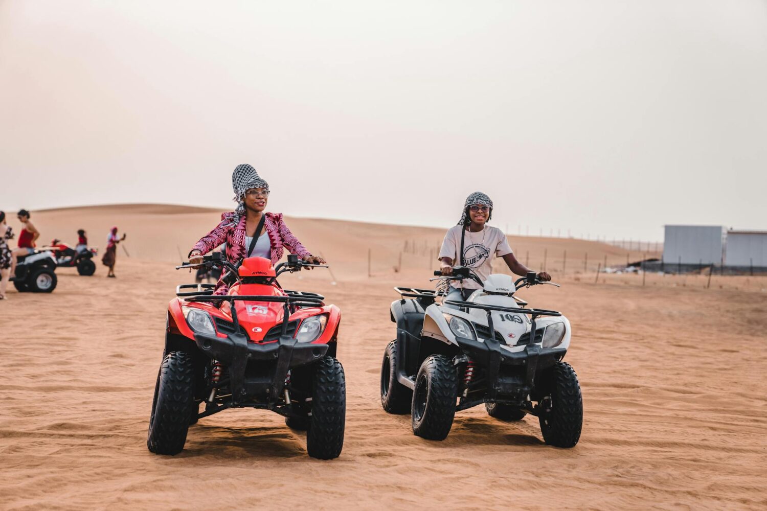 Two travellers riding ATVs in the Agafay Desert near Marrakech