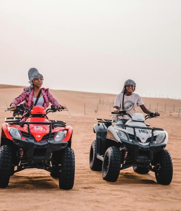 Two travellers riding ATVs in the Agafay Desert near Marrakech