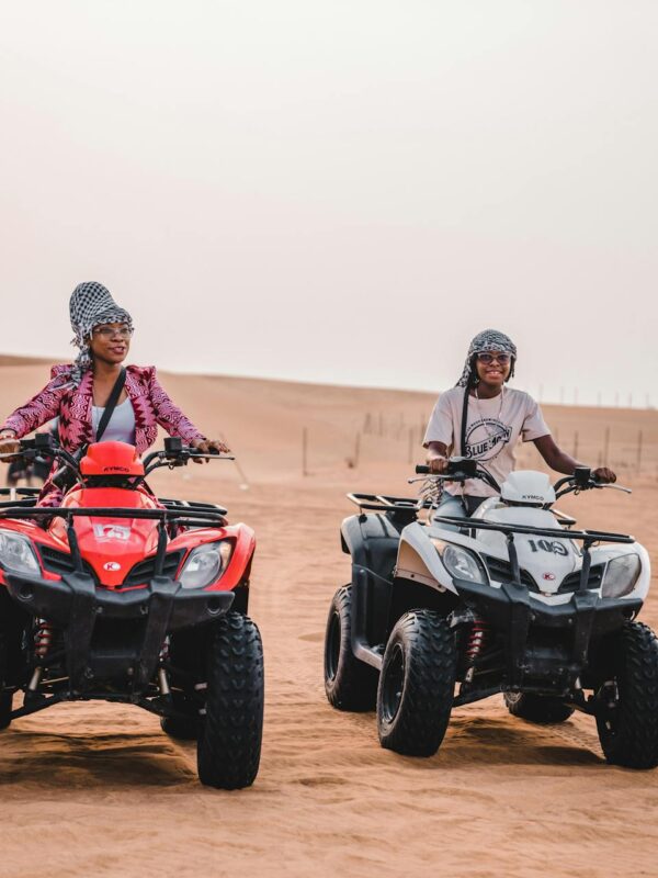 Two travellers riding ATVs in the Agafay Desert near Marrakech
