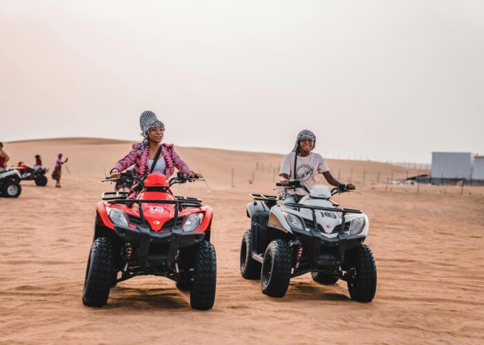 Two travellers riding ATVs in the Agafay Desert near Marrakech