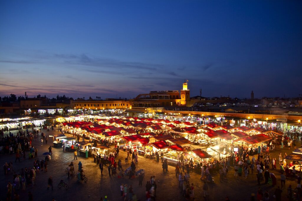 Night view of Marrakech city with illuminated streets and vibrant atmosphere