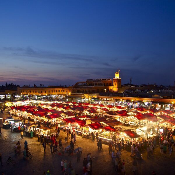 9-Day Imperial Cities & Sahara Tour from Casablanca. Night view of Marrakech city with illuminated streets and vibrant atmosphere