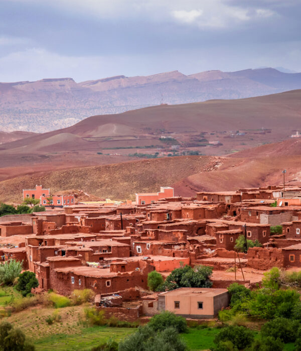 Atlas Mountains Morocco Berber village – traditional clay houses and red valley landscape near Marrakech.