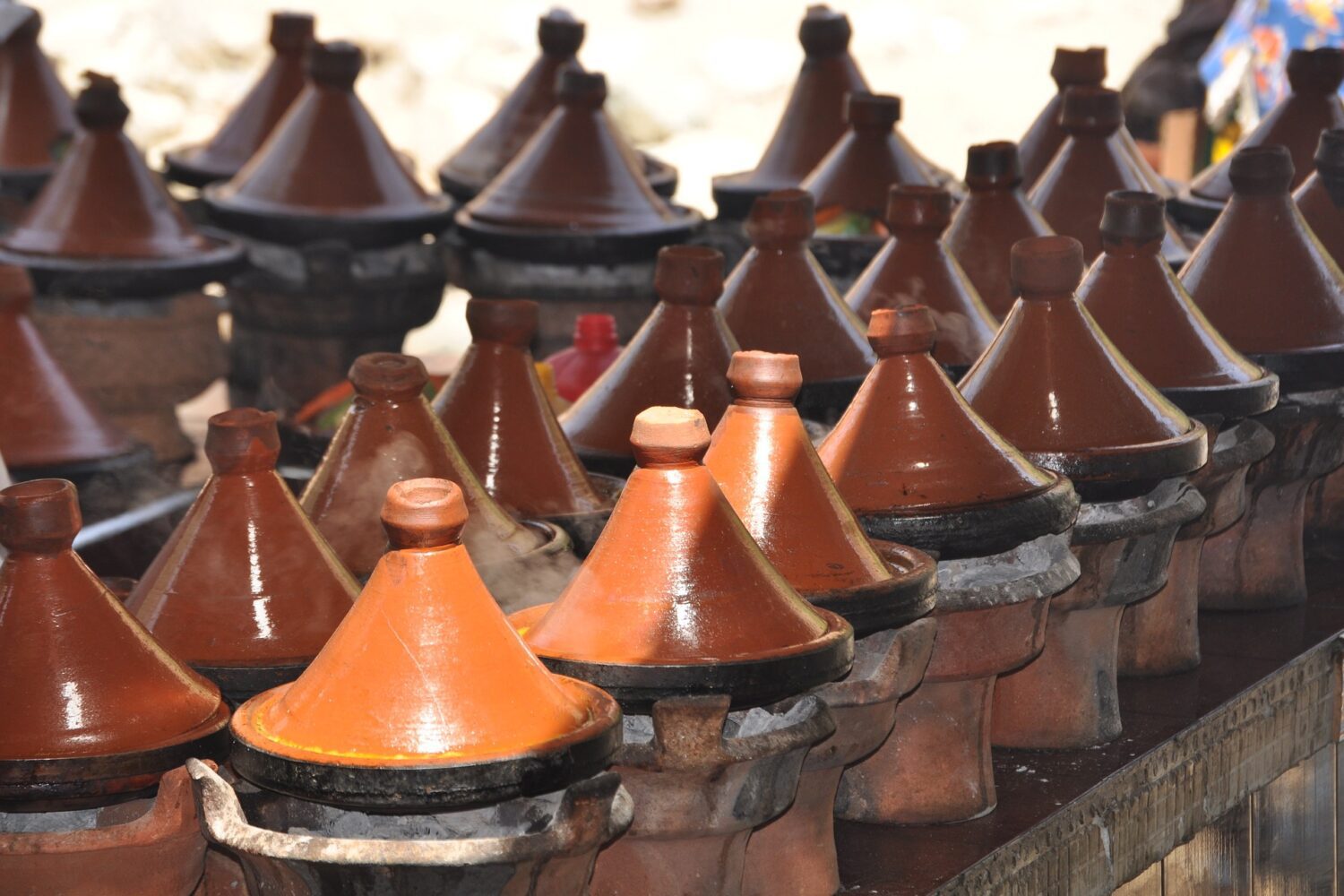 Traditional Moroccan tajine pots cooking local food in Ourika Valley