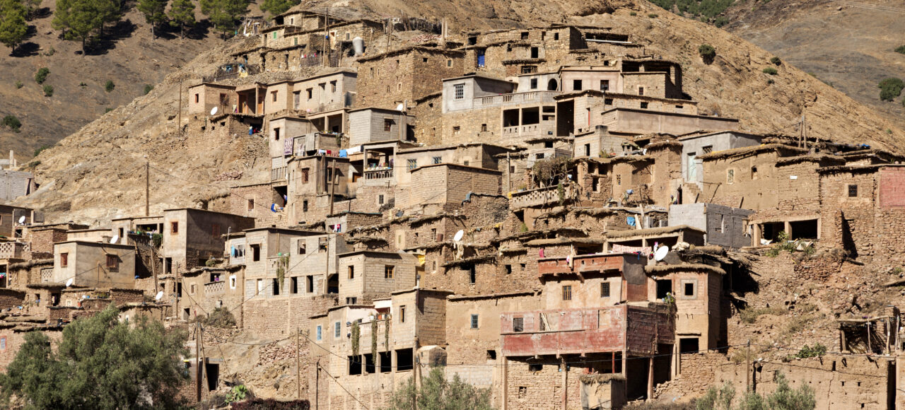 Traditional Berber village in the Atlas Mountains, Morocco – authentic mud-brick houses and mountain scenery during 12-Day Jewish Heritage Tour in Morocco from Marrakech