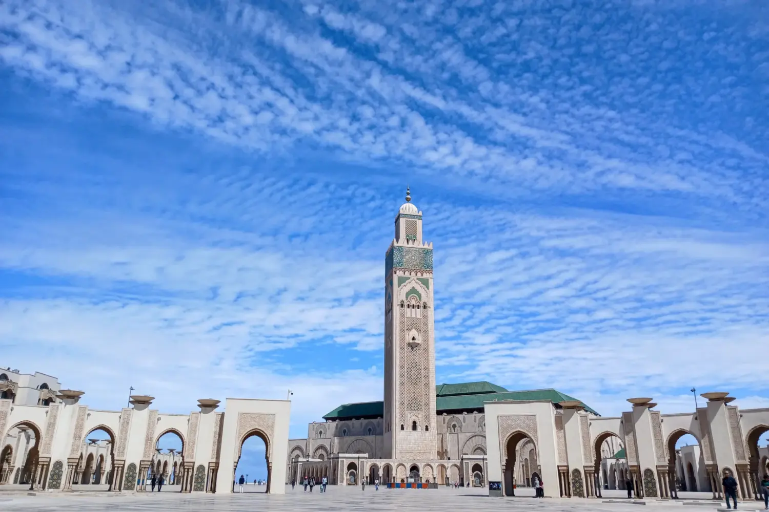 Hassan II Mosque in Casablanca Morocco with blue sky and Islamic architecture during 30 Day Morocco Explorer Tour from Casablanca.