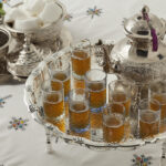 Traditional Moroccan mint tea served in a silver teapot and glasses, showing Morocco’s safe and welcoming hospitality.