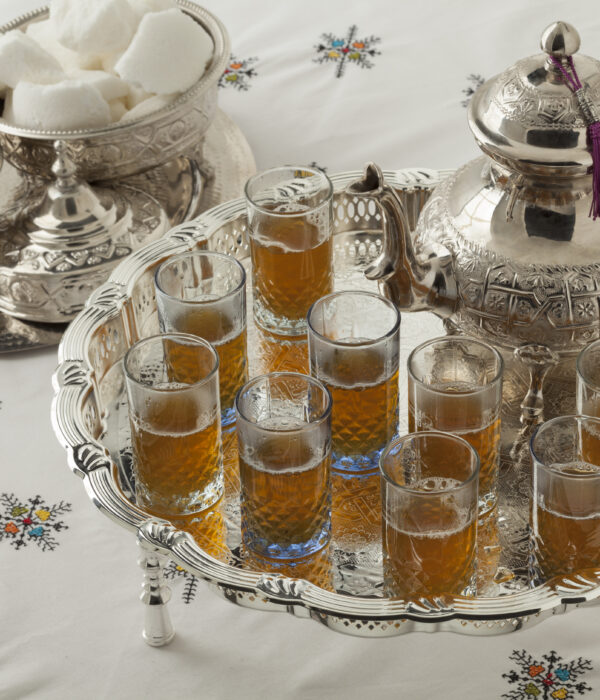 Traditional Moroccan mint tea served in a silver teapot and glasses, showing Morocco’s safe and welcoming hospitality.