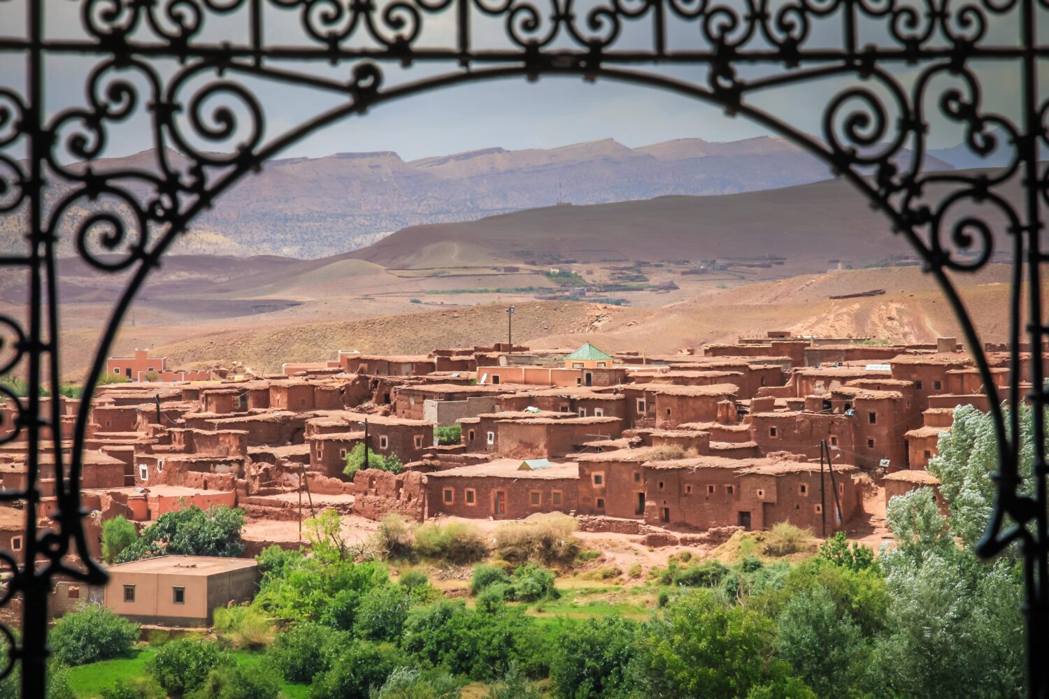 Telouet village in the High Atlas, Morocco, framed by a traditional wrought-iron arch