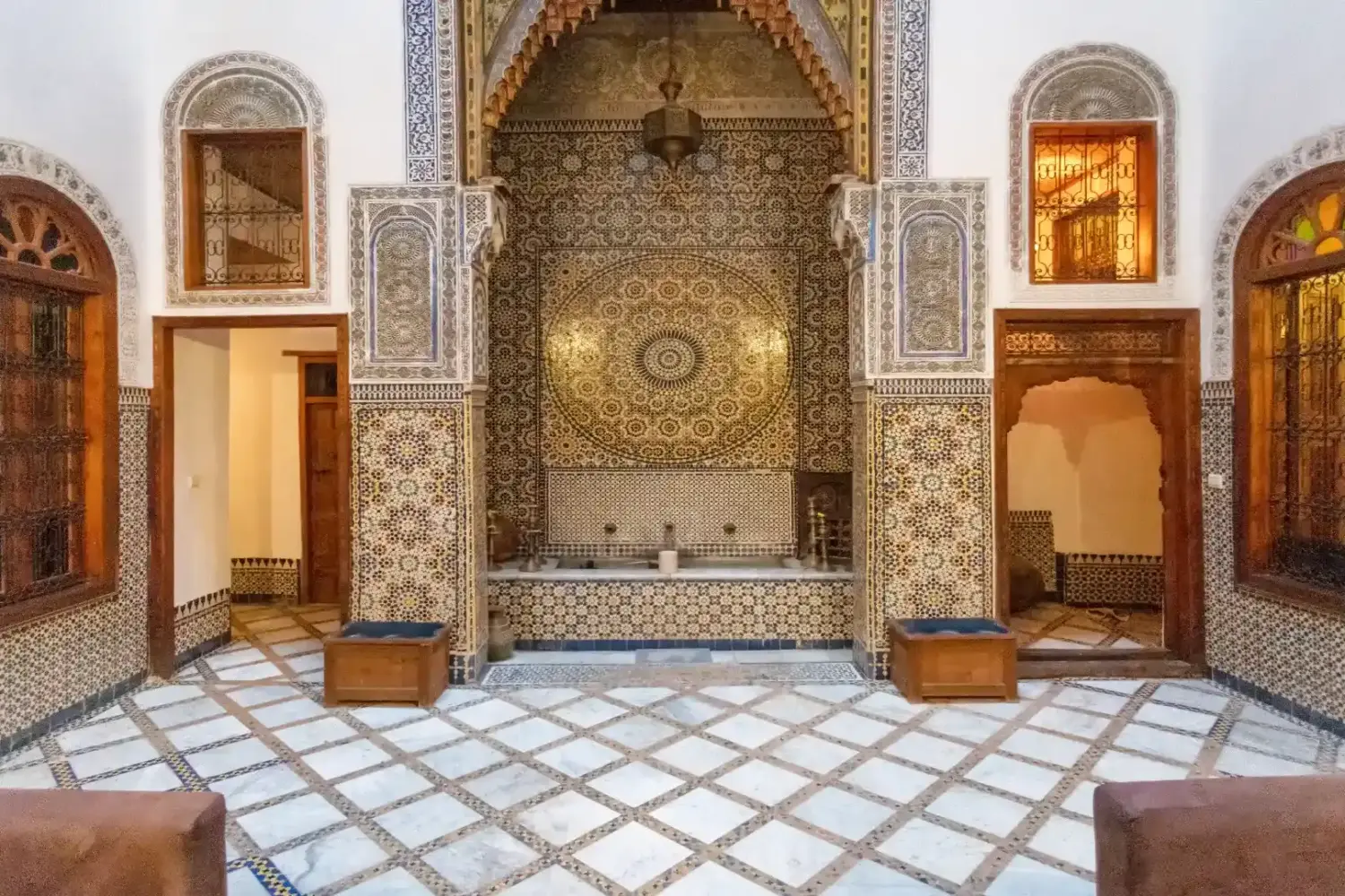 Courtyard at a traditional riad in Fes el Bali, Moroccan architecture with zellige tiles