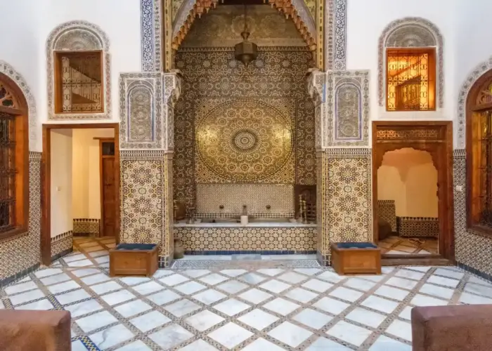 Courtyard at a traditional riad in Fes el Bali, Moroccan architecture with zellige tiles
