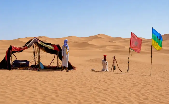 Nomad man in the heart of the Merzouga Desert sand dunes in Morocco with Morocco Marrakech Gems