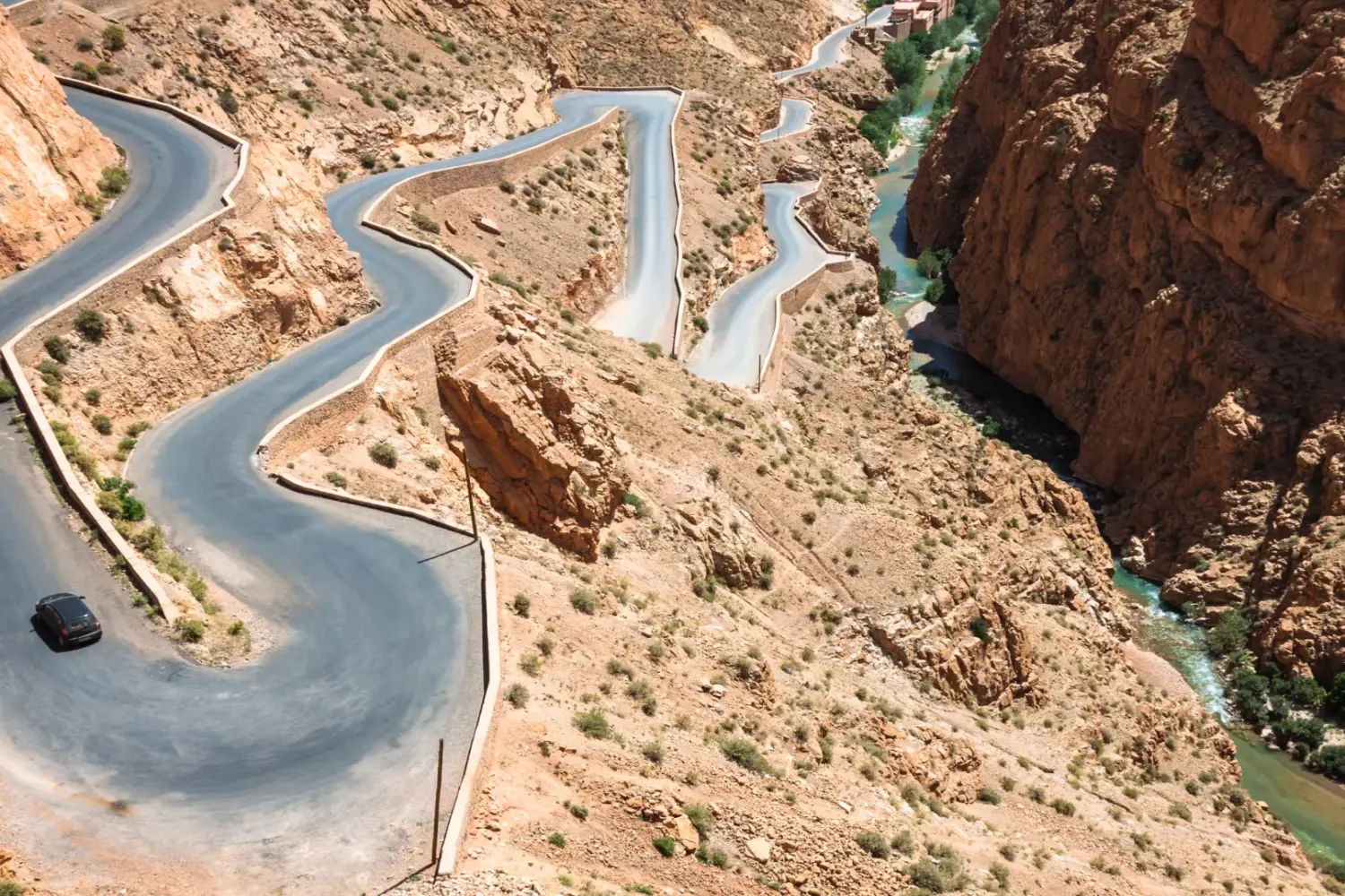 Winding road in Dades Valley Morocco surrounded by deep canyons and dramatic mountain landscapes