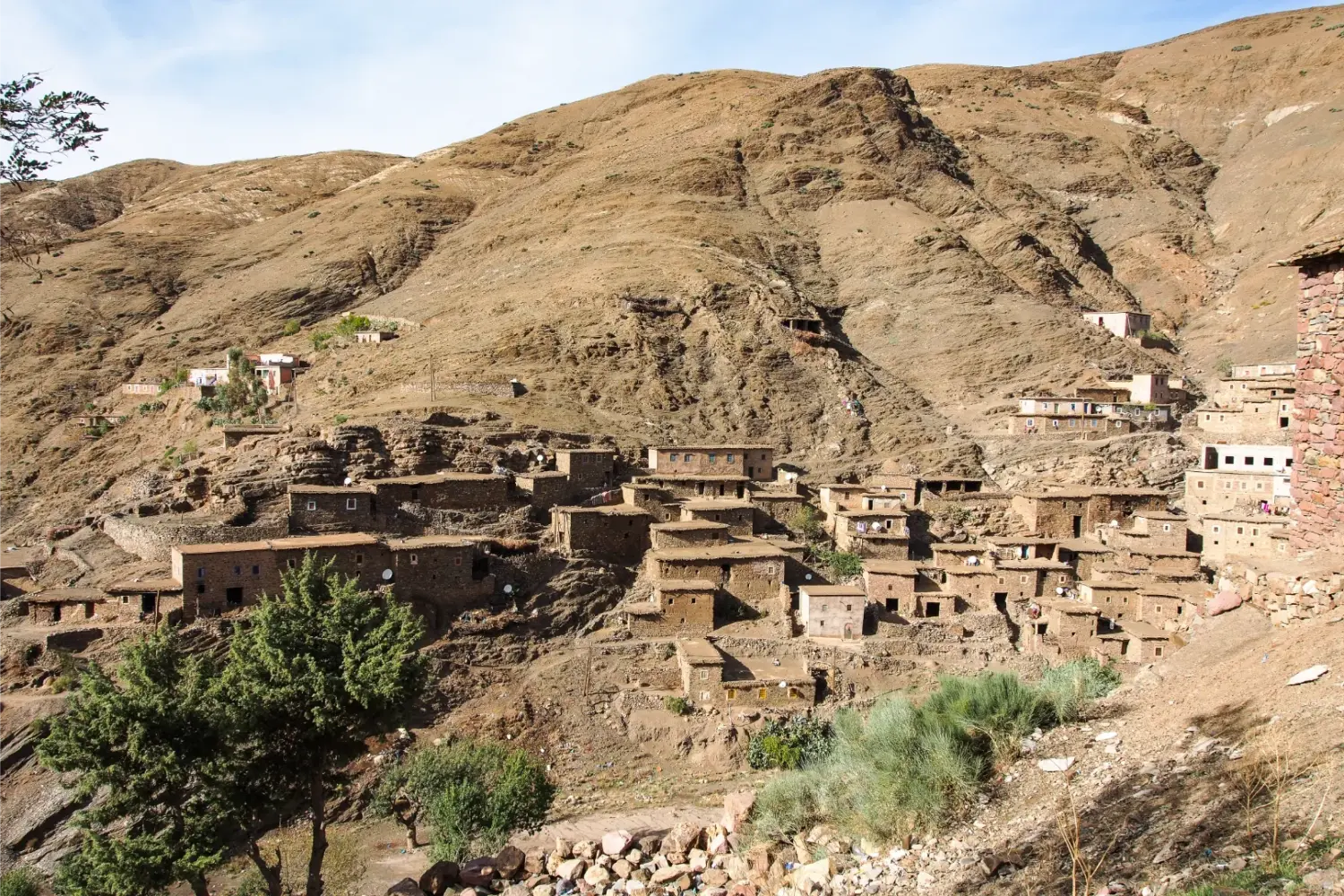 Authentic Berber village in the High Atlas Mountains morocco Rocky mountain village landscape in southern Morocco on the 21-Day Private Morocco Explorer Tour