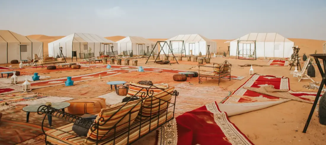 luxury campin merzouga sahara desert Luxury desert camp in Merzouga Sahara with traditional tents and seating area for how many days do you need in morocco? 2026