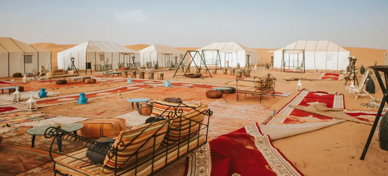 Luxury desert camp in Merzouga Sahara with traditional tents and seating area for how many days do you need in morocco? 2026