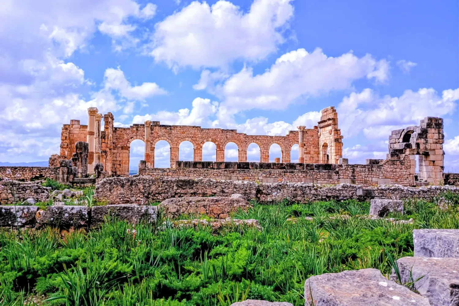Ancient Roman columns in Volubilis Morocco on 9 day cultural tour from Casablanca