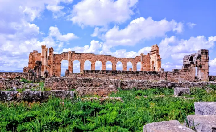 Ancient Roman columns in Volubilis Morocco on 9 day cultural tour from Casablanca