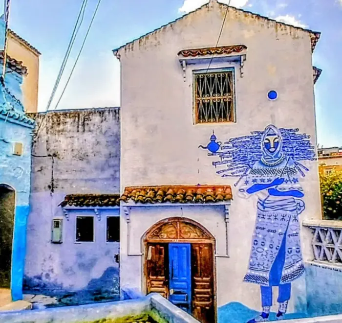 Blue house entrance in Chefchaouen medina on 9 day tour from Marrakech to Casablanca