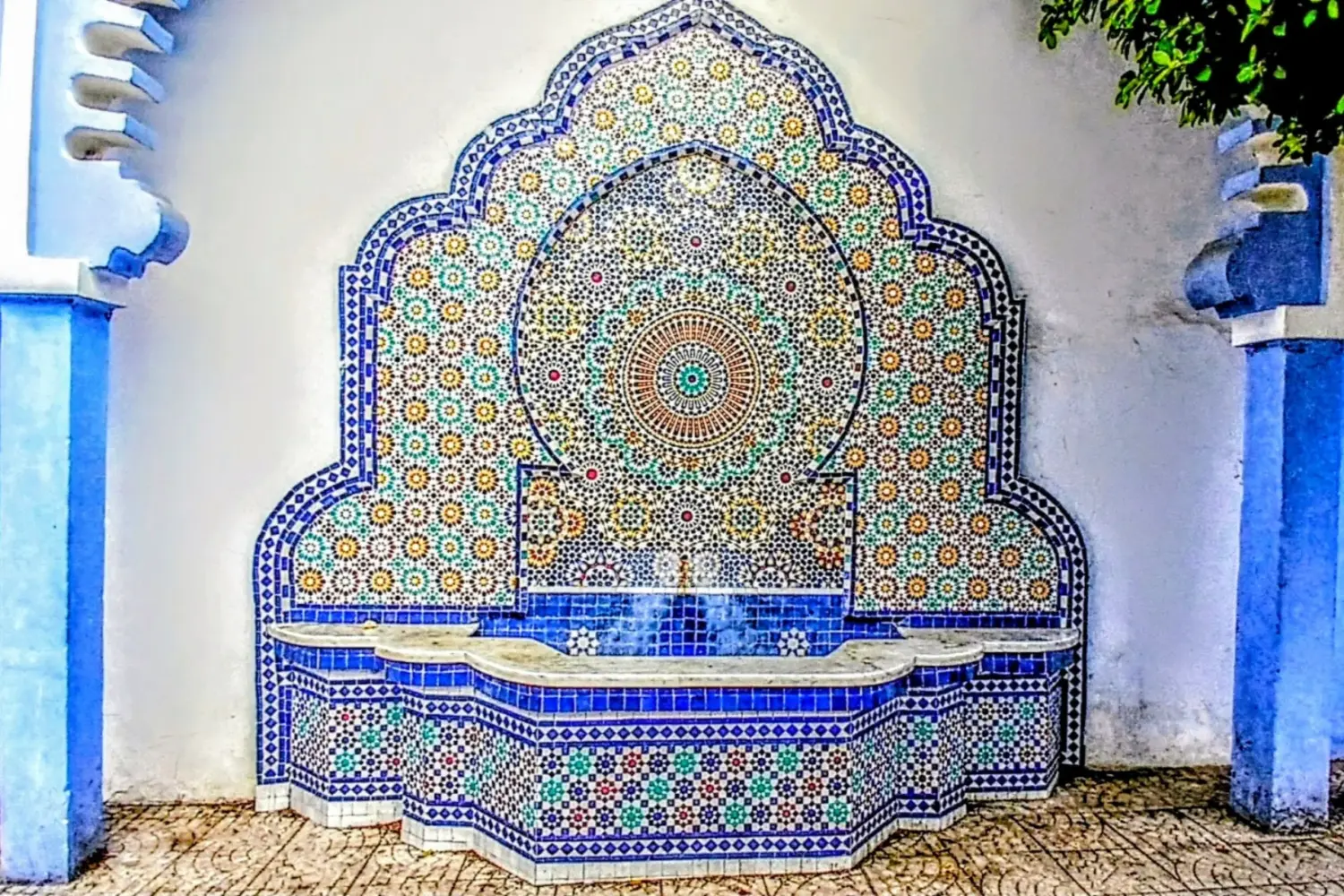 Colorful Moroccan zellige fountain in Chefchaouen on a Day Trip from Fes to Chefchaouen