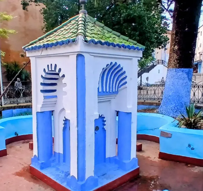 Blue decorative arch in Chefchaouen medina on 13 Day Morocco Desert and Coast Tour