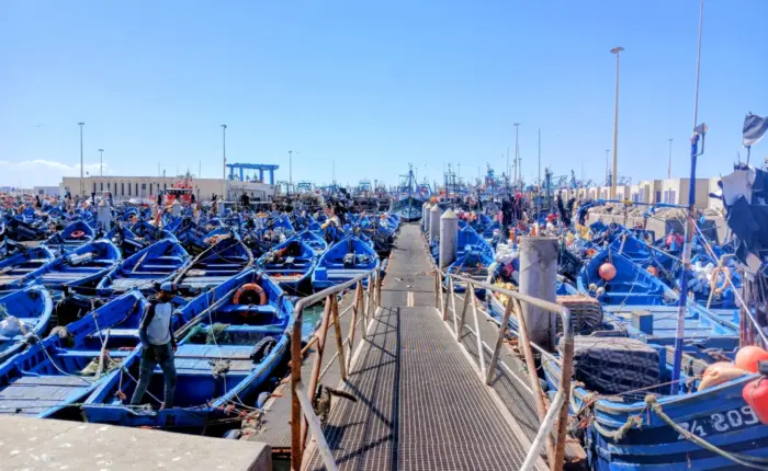 Essaouira fishing port with blue boats Morocco