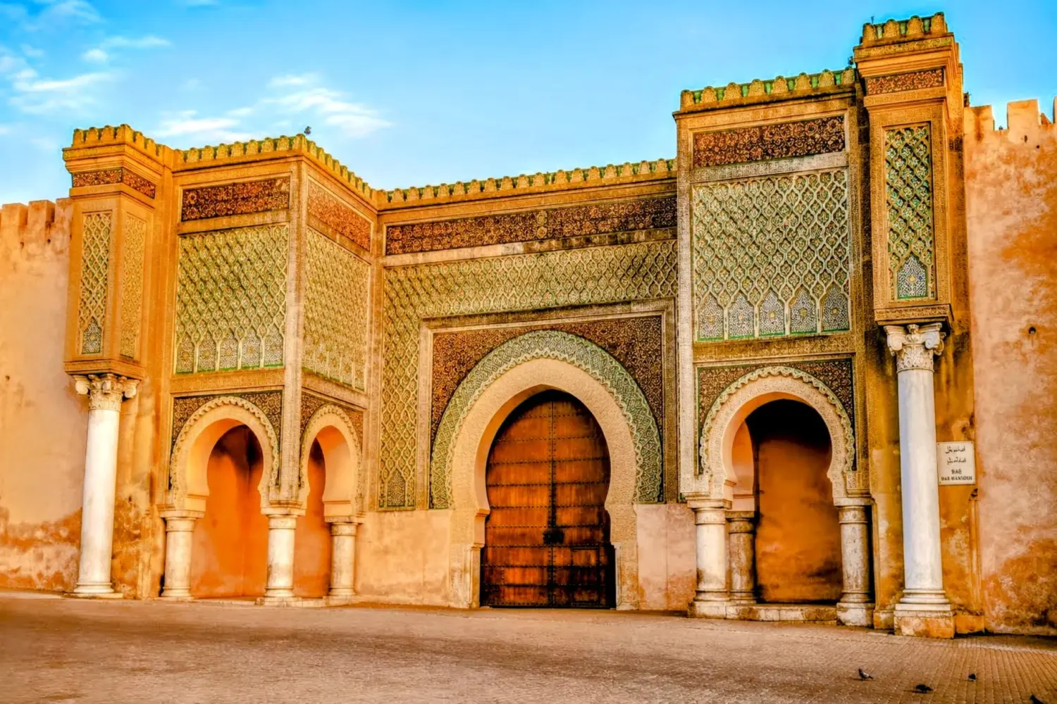 Bab Mansour Gate in Meknes, one of Morocco’s most magnificent historic gates, famous for its intricate zellige tilework and grand architecture visited on 5 Day Tangier to Casablanca Private Tour