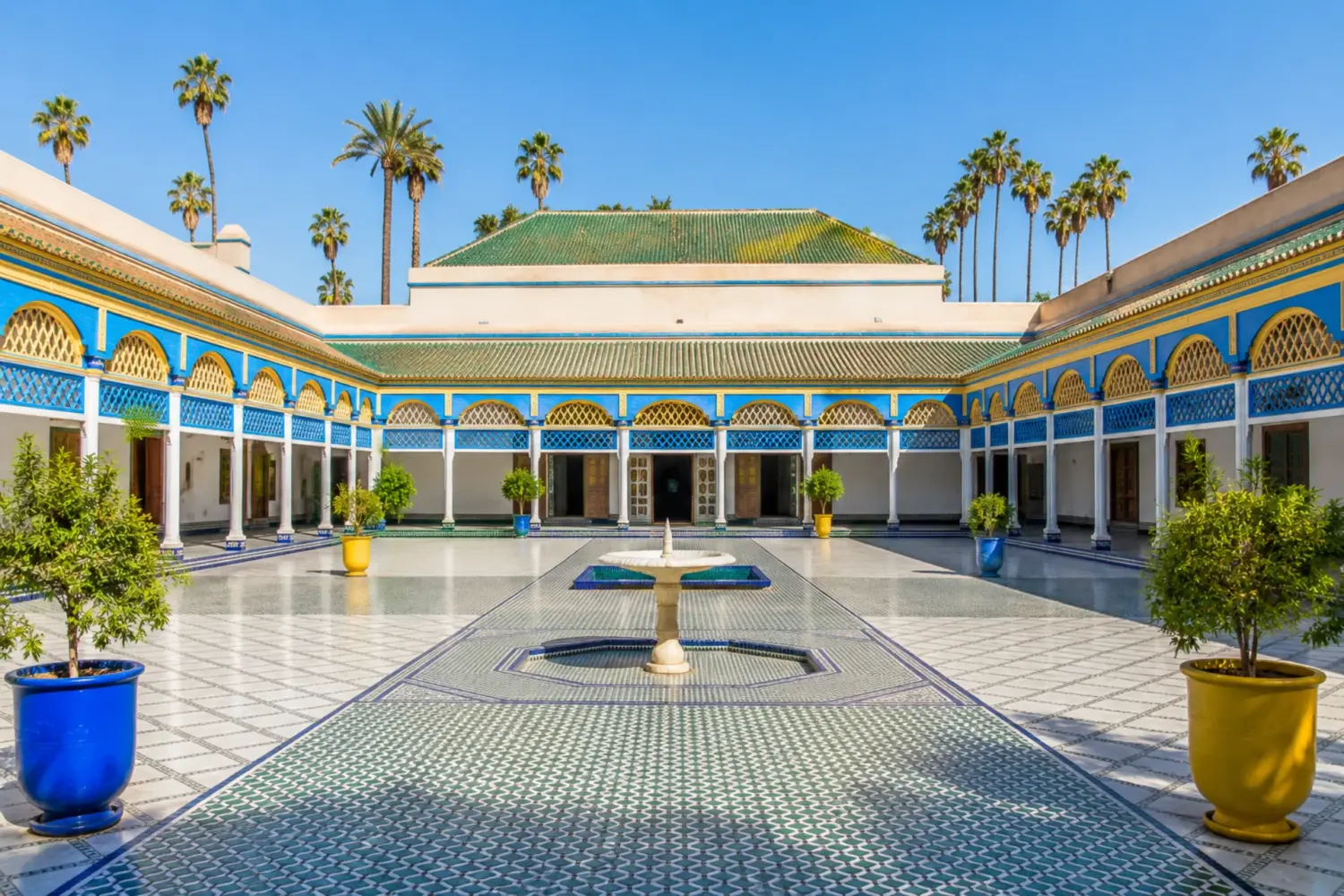 Grand courtyard of Bahia Palace in Marrakech with traditional Moroccan architecture during 30 Day Morocco Explorer Tour from Casablanca.