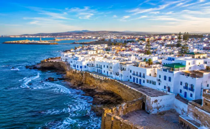 22 Day Morocco Discovery Tour from Casablanca. featuring the coastal city of Asilah with its whitewashed medina, historic walls, and Atlantic Ocean views