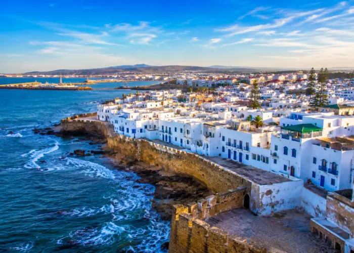 5 Day Tangier to Casablanca Private Tour featuring the coastal city of Asilah with its whitewashed medina, historic walls, and Atlantic Ocean views