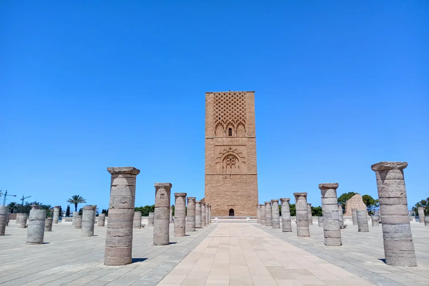 Historic Hassan Tower in Rabat, one of Morocco's most famous landmarks during 9 Day Sahara and Chefchaouen Tour from Casablanca