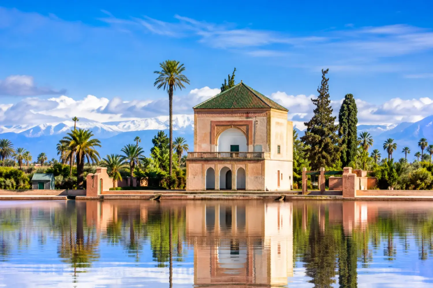 Menara Garden pavilion with reflecting pool and Atlas Mountains in Marrakech on 5 Day Morocco Heritage Tour from Marrakech to Tangier