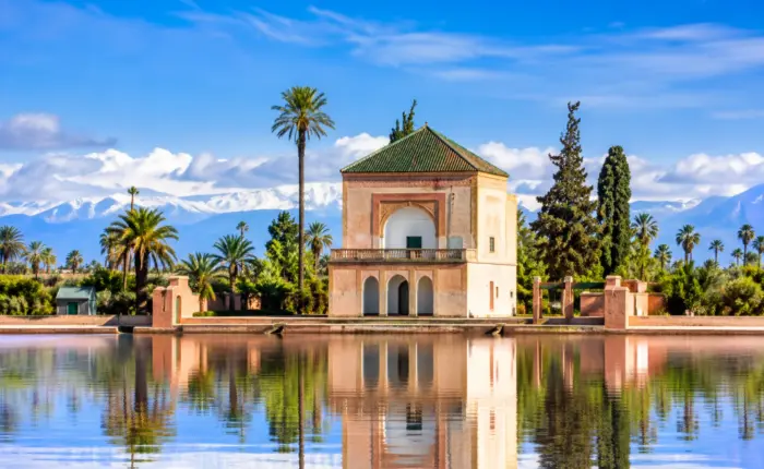 Menara Garden pavilion with reflecting pool and Atlas Mountains in Marrakech