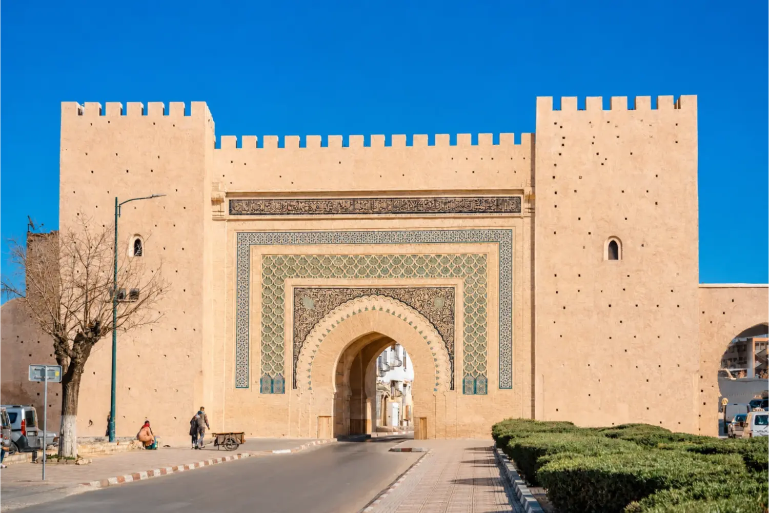 Historic gate in Rabat, Morocco, showcasing traditional Moroccan architecture and decorative tilework during 2 Day Tour from Fes to Marrakech via Rabat and Casablanca