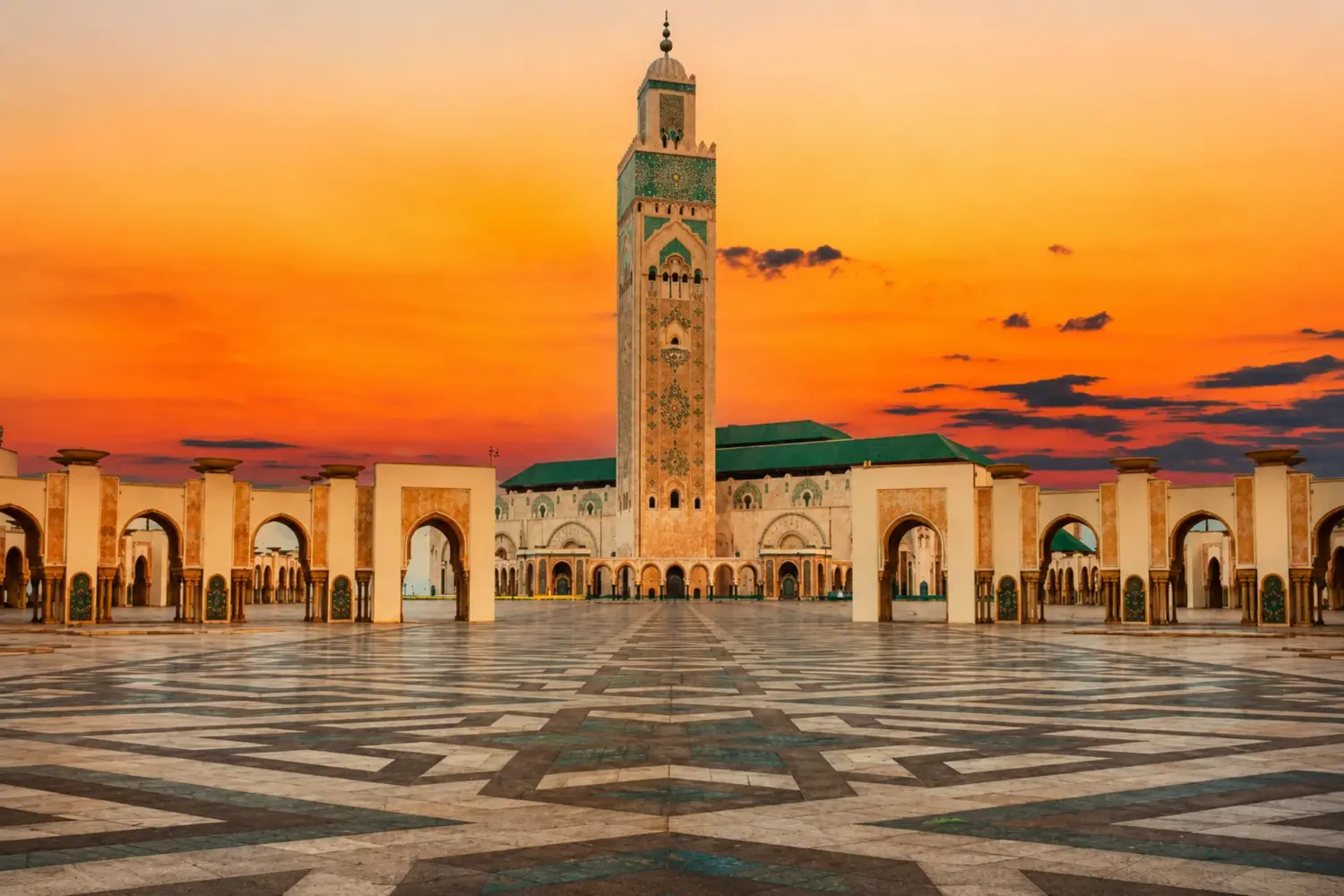 Hassan II Mosque illuminated at sunset in Casablanca, Morocco visited during 5 Day Morocco Heritage Tour from Marrakech to Tangier