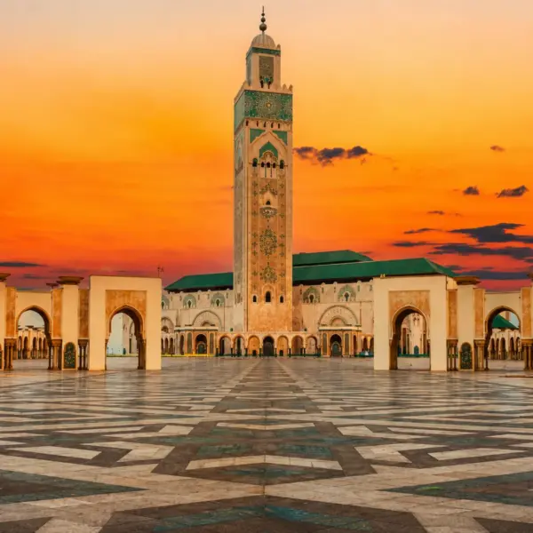 Hassan II Mosque illuminated at sunset in Casablanca, Morocco visited during 3 Day Tour from Fes to Marrakech via Chefchaouen