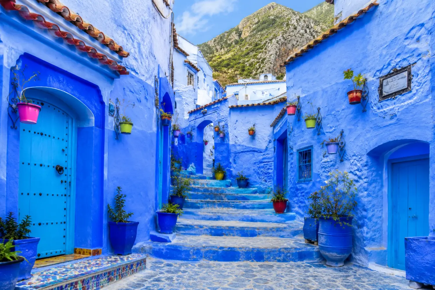 Blue streets and traditional architecture in Chefchaouen during the 30 Day Morocco Explorer Tour from Casablanca.